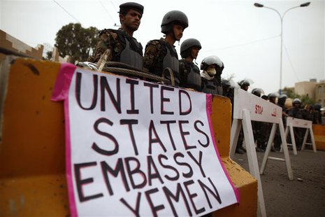Riot policemen stand guard during a protest to demand the release of Yemeni detainees in the prison of Guantanamo Bay, outside the U.S. emba Riot policemen stand guard during a protest to demand the release of Yemeni detainees in the prison of Guantanamo Bay, outside the U.S. emba