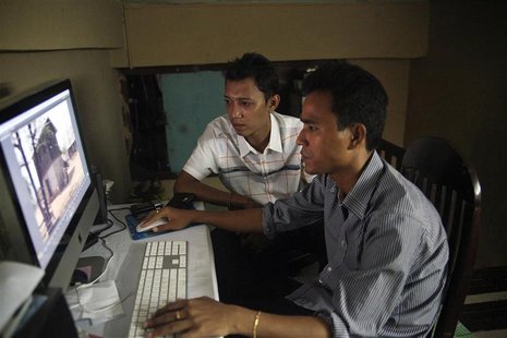 Movie director Zay Par (L) and his editor Zin Thaw work on their movie in the editing room in downtown Yangon July 19, 2013. REUTERS/Jared F Movie director Zay Par (L) and his editor Zin Thaw work on their movie in the editing room in downtown Yangon July 19, 2013. REUTERS/Jared F