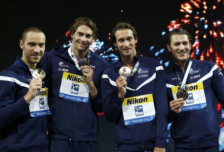 Team France pose with their gold medals at the men's 4x100m medley relay victory ceremony during the World Swimming Championships at the San Team France pose with their gold medals at the men's 4x100m medley relay victory ceremony during the World Swimming Championships at the San