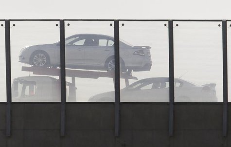 New cars are transported on a truck on a freeway in south Sydney June 26, 2013. REUTERS/Daniel Munoz New cars are transported on a truck on a freeway in south Sydney June 26, 2013. REUTERS/Daniel Munoz
