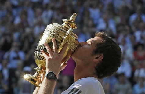 Andy Murray of Britain kisses the winners trophy after defeating Novak Djokovic of Serbia in their men's singles final tennis match at the W Andy Murray of Britain kisses the winners trophy after defeating Novak Djokovic of Serbia in their men's singles final tennis match at the W