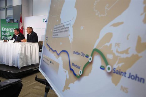 TransCanada President and CEO Russ Girling (2nd L) announces the new Energy East Pipeline during a news conference in Calgary, Alberta, in t TransCanada President and CEO Russ Girling (2nd L) announces the new Energy East Pipeline during a news conference in Calgary, Alberta, in t