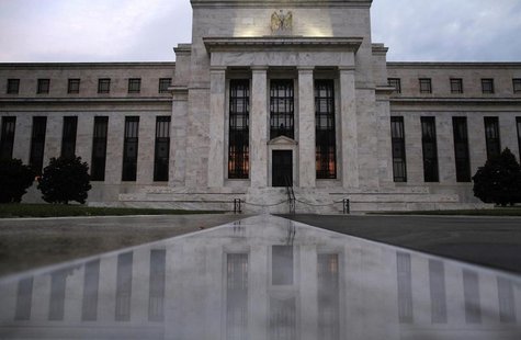 The facade of the U.S. Federal Reserve building is reflected on wet marble during the early morning hours in Washington, July 31, 2013. REUT The facade of the U.S. Federal Reserve building is reflected on wet marble during the early morning hours in Washington, July 31, 2013. REUT
