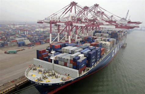 A cargo ship loaded with containers is seen anchored at a port in Qingdao, Shandong province July 10, 2013. REUTERS/China Daily A cargo ship loaded with containers is seen anchored at a port in Qingdao, Shandong province July 10, 2013. REUTERS/China Daily