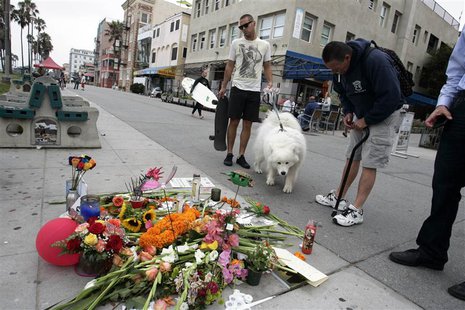 People gather at a makeshift memorial on the Venice Beach boardwalk for Alice Gruppioni, a tourist on her honeymoon from Bologna, Italy, who People gather at a makeshift memorial on the Venice Beach boardwalk for Alice Gruppioni, a tourist on her honeymoon from Bologna, Italy, who