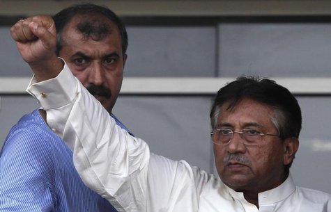 Pakistan's former President Pervez Musharraf gestures to his supporters upon his arrival from Dubai at Jinnah International airport in Karac Pakistan's former President Pervez Musharraf gestures to his supporters upon his arrival from Dubai at Jinnah International airport in Karac