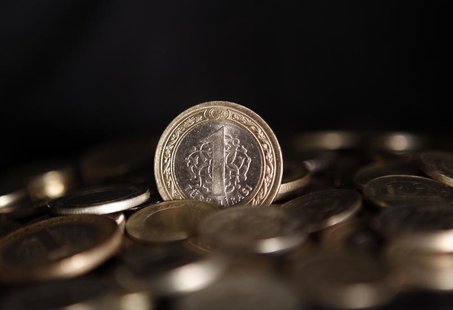 Stacks of Turkey's lira coins are seen in this picture illustration taken in Istanbul July 15, 2013. REUTERS/Osman Orsal Stacks of Turkey's lira coins are seen in this picture illustration taken in Istanbul July 15, 2013. REUTERS/Osman Orsal