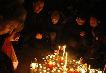 People light candles during a commemoration ceremony in Budapest to honour victims of a double homicide in the village of Tatarszentgyorgy t People light candles during a commemoration ceremony in Budapest to honour victims of a double homicide in the village of Tatarszentgyorgy t