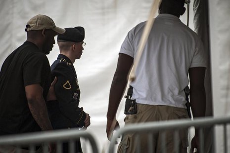 U.S. Army Private First Class Bradley Manning is escorted into court for the second day of the sentencing phase in his military trial at For U.S. Army Private First Class Bradley Manning is escorted into court for the second day of the sentencing phase in his military trial at For