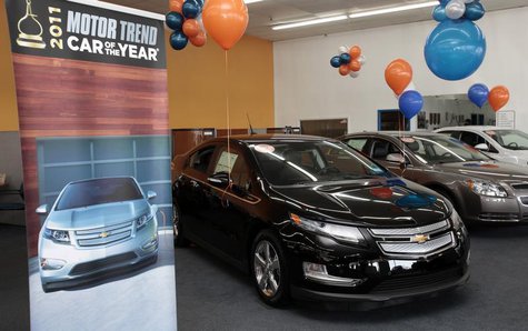 A black 2012 Chevrolet Volt electric car is seen on display in the showroom of George Matick Chevrolet auto sales in Redford, Michigan Janua A black 2012 Chevrolet Volt electric car is seen on display in the showroom of George Matick Chevrolet auto sales in Redford, Michigan Janua