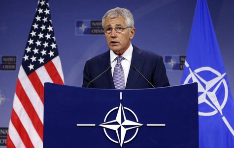Defense Secretary Chuck Hagel addresses a news conference during a NATO defence ministers meeting at the Alliance headquarters in Brussels J Defense Secretary Chuck Hagel addresses a news conference during a NATO defence ministers meeting at the Alliance headquarters in Brussels J