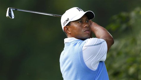 Tiger Woods of the U.S. watches his shot from the 15th tee during a practice round for the 2013 PGA Championship golf tournament at Oak Hill Tiger Woods of the U.S. watches his shot from the 15th tee during a practice round for the 2013 PGA Championship golf tournament at Oak Hill