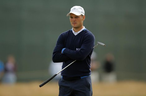 Martin Kaymer of Germany waits to putt on the first green during the first round of the British Open golf Championship at Muirfield in Scotl Martin Kaymer of Germany waits to putt on the first green during the first round of the British Open golf Championship at Muirfield in Scotl