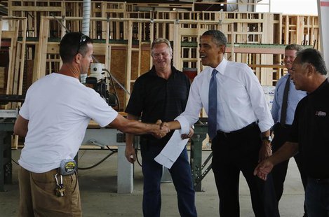 U.S. President Barack Obama (center R) is greeted as he looks at building supplies while touring Erickson Construction in Chandler, Arizona, U.S. President Barack Obama (center R) is greeted as he looks at building supplies while touring Erickson Construction in Chandler, Arizona,
