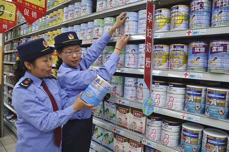 Chinese commercial law enforcement personnel inspect milk powder products at a supermarket in Lianyungang, Jiangsu province August 6, 2013. Chinese commercial law enforcement personnel inspect milk powder products at a supermarket in Lianyungang, Jiangsu province August 6, 2013.
