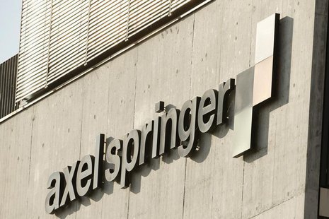 The logo of German publisher Axel Springer is seen at an office building in Zurich July 25, 2013. REUTERS/Arnd Wiegmann The logo of German publisher Axel Springer is seen at an office building in Zurich July 25, 2013. REUTERS/Arnd Wiegmann