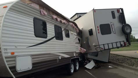 Storm damages vehicles in the parking lot of Quality RV in Kaukauna on August 7, 2013. (Photo by: Jeff Flynt). Storm damages vehicles in the parking lot of Quality RV in Kaukauna on August 7, 2013. (Photo by: Jeff Flynt).