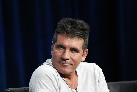Judge Simon Cowell attends a panel for the television series "The X Factor" during the Fox portion of the Television Critics Association Sum Judge Simon Cowell attends a panel for the television series "The X Factor" during the Fox portion of the Television Critics Association Sum