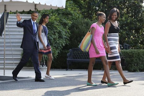 U.S. President Barack Obama (L) waves as he and his wife Michelle (R) and daughters Malia (2nd L) and Sasha (2nd R) depart for travel to Afr U.S. President Barack Obama (L) waves as he and his wife Michelle (R) and daughters Malia (2nd L) and Sasha (2nd R) depart for travel to Afr