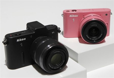 Nikon Corp's new camera Nikon 1 V1 (L) and J1 are displayed at its unveiling ceremony in Tokyo September 21, 2011. REUTERS/Kim Kyung-Hoon Nikon Corp's new camera Nikon 1 V1 (L) and J1 are displayed at its unveiling ceremony in Tokyo September 21, 2011. REUTERS/Kim Kyung-Hoon