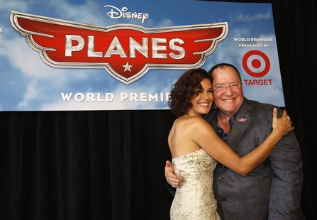 John Lasseter (R), Chief Creative Officer at Pixar and Walt Disney animation studios, poses with actress Teri Hatcher, who voices the charac John Lasseter (R), Chief Creative Officer at Pixar and Walt Disney animation studios, poses with actress Teri Hatcher, who voices the charac