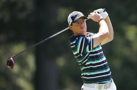 Northern Ireland's Rory McIlroy makes his second shot after hitting out of bounds from the fourth tee during the third round of the 2013 PGA Northern Ireland's Rory McIlroy makes his second shot after hitting out of bounds from the fourth tee during the third round of the 2013 PGA