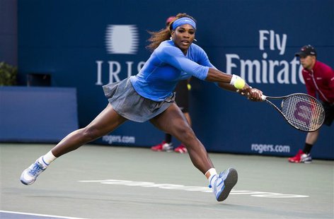 Serena Williams of the U.S. returns a shot to Agnieszka Radwanska of Poland during their women's semi-final tennis match at the Rogers Cup t Serena Williams of the U.S. returns a shot to Agnieszka Radwanska of Poland during their women's semi-final tennis match at the Rogers Cup t