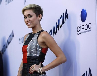 Singer Miley Cyrus poses at the premiere of "Paranoia" in Los Angeles, California August 8, 2013. The movie opens in the U.S. on August 16. Singer Miley Cyrus poses at the premiere of "Paranoia" in Los Angeles, California August 8, 2013. The movie opens in the U.S. on August 16.