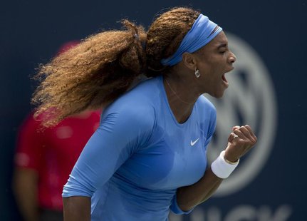 Serena Williams of the U.S. reacts against Sorana Cirstea of Romania during their women's final tennis match of the Rogers Cup tennis tourna Serena Williams of the U.S. reacts against Sorana Cirstea of Romania during their women's final tennis match of the Rogers Cup tennis tourna
