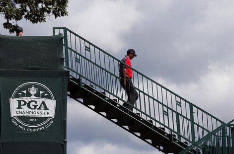 Tiger Woods of the U.S. walks to the first tee during the final round of the 2013 PGA Championship golf tournament at Oak Hill Country Club Tiger Woods of the U.S. walks to the first tee during the final round of the 2013 PGA Championship golf tournament at Oak Hill Country Club