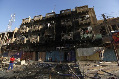 A boy looks at the site of a car bomb attack in the Shaab neighbourhood of northern Baghdad August 11, 2013. REUTERS/Thaier al-Sudani A boy looks at the site of a car bomb attack in the Shaab neighbourhood of northern Baghdad August 11, 2013. REUTERS/Thaier al-Sudani