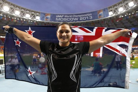 Valerie Adams of New Zealand celebrates with her national flag after winning the women's shot put final during the IAAF World Athletics Cham Valerie Adams of New Zealand celebrates with her national flag after winning the women's shot put final during the IAAF World Athletics Cham