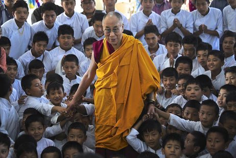 Exiled Tibetan spiritual leader the Dalai Lama poses for a picture with the students of a Tibetan school after inaugurating its auditorium a Exiled Tibetan spiritual leader the Dalai Lama poses for a picture with the students of a Tibetan school after inaugurating its auditorium a
