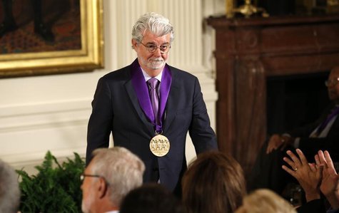 Film producer George Lucas walks to his seat after U.S. President Barack Obama awarded him the 2012 National Medal of Arts during a ceremony Film producer George Lucas walks to his seat after U.S. President Barack Obama awarded him the 2012 National Medal of Arts during a ceremony