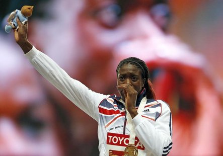 Winner Christine Ohuruogu of Britain reacts on the podium at the victory ceremony for the women's 400 metres final during the IAAF World Ath Winner Christine Ohuruogu of Britain reacts on the podium at the victory ceremony for the women's 400 metres final during the IAAF World Ath