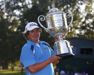 Jason Dufner of the U.S. poses with the Wanamaker trophy after winning the 2013 PGA Championship golf tournament at Oak Hill Country Club in Rochester, New York August 11, 2013. REUTERS/Jeff Haynes Jason Dufner of the U.S. poses with the Wanamaker trophy after winning the 2013 PGA Championship golf tournament at Oak Hill Country Club in Rochester, New York August 11, 2013. REUTERS/Jeff Haynes