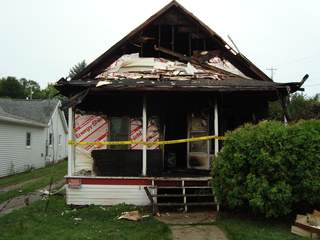 House at 705 Dodge Street in Kaukauna damaged by fire on August 11, 2013. (Photo by: FOX 11). House at 705 Dodge Street in Kaukauna damaged by fire on August 11, 2013. (Photo by: FOX 11).