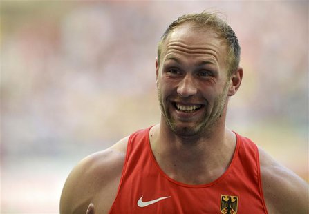 Robert Harting of Germany celebrates after winning gold at the men's discus throw final during the IAAF World Athletics Championships at the Robert Harting of Germany celebrates after winning gold at the men's discus throw final during the IAAF World Athletics Championships at the