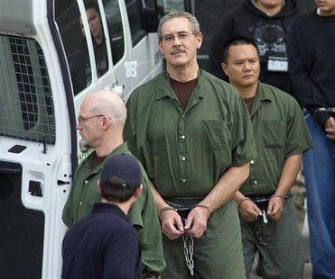 Allen Stanford (C) leaves the Federal Courthouse where the jury found him guilty, in Houston in this file photo from March 6, 2012. REUTERS/ Allen Stanford (C) leaves the Federal Courthouse where the jury found him guilty, in Houston in this file photo from March 6, 2012. REUTERS/