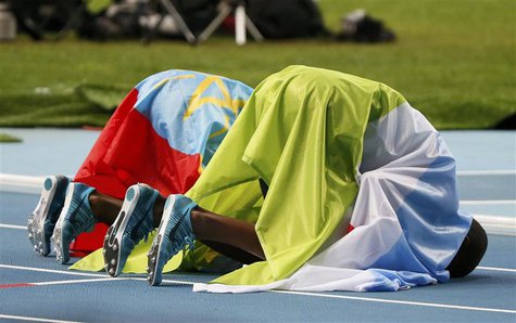 Winner Mohammed Aman (L) of Ethiopia and third placed Ayanleh Souleiman of Djibouti bow after the men's 800 metres final of the IAAF World A Winner Mohammed Aman (L) of Ethiopia and third placed Ayanleh Souleiman of Djibouti bow after the men's 800 metres final of the IAAF World A