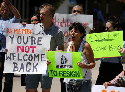 Opponents of San Diego Mayor Bob Filner hold placards during a "Not Welcome Back'' rally at the Civic Center Plaza in downtown San Diego, Ca Opponents of San Diego Mayor Bob Filner hold placards during a "Not Welcome Back'' rally at the Civic Center Plaza in downtown San Diego, Ca