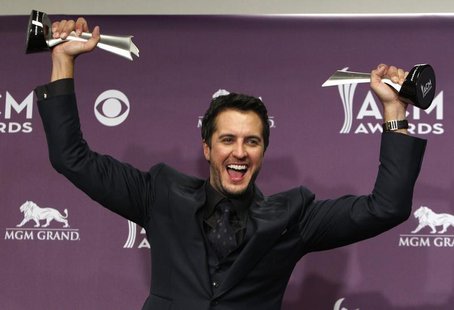 Luke Bryan poses with his awards for entertainer of the year and vocal event of the year at the 48th ACM Awards in Las Vegas April 7, 2013 f Luke Bryan poses with his awards for entertainer of the year and vocal event of the year at the 48th ACM Awards in Las Vegas April 7, 2013 f