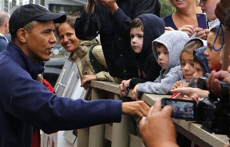 U.S. President Barack Obama talks with children outside before ordering at Nancy's restaurant at Oak Bluffs in Martha's Vineyard August 13, U.S. President Barack Obama talks with children outside before ordering at Nancy's restaurant at Oak Bluffs in Martha's Vineyard August 13,