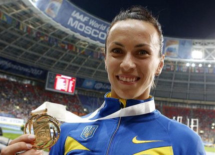 Gold medallist Ganna Melnichenko of Ukraine shows her medal at the women's heptathlon victory ceremony during the IAAF World Athletics Champ Gold medallist Ganna Melnichenko of Ukraine shows her medal at the women's heptathlon victory ceremony during the IAAF World Athletics Champ