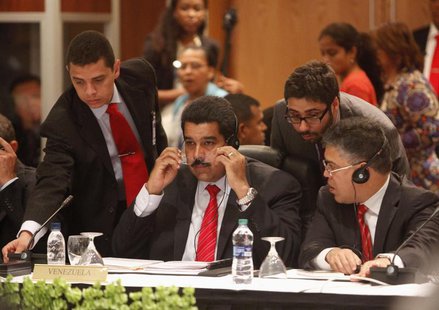 Venezuelan President Nicholas Maduro sits among other officials as he attends a plenary session with CARICOM leaders at the 40th Heads of go Venezuelan President Nicholas Maduro sits among other officials as he attends a plenary session with CARICOM leaders at the 40th Heads of go