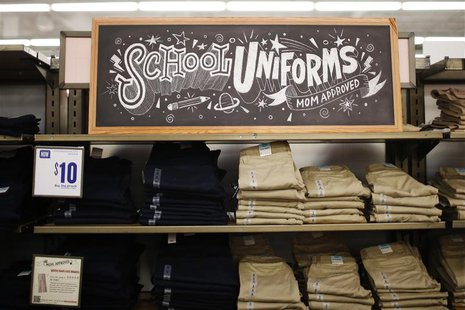 A stack of school uniforms are seen on the shelves inside the Old Navy clothing shop during a "ChildSpree" back-to-school shopping event in A stack of school uniforms are seen on the shelves inside the Old Navy clothing shop during a "ChildSpree" back-to-school shopping event in