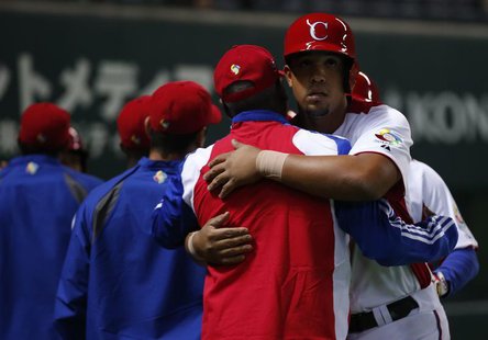 Cuba's Jose Abreu reacts with teammates after hitting a grand slam off China's Liu Yu in the fifth inning at the World Baseball Classic (WBC Cuba's Jose Abreu reacts with teammates after hitting a grand slam off China's Liu Yu in the fifth inning at the World Baseball Classic (WBC