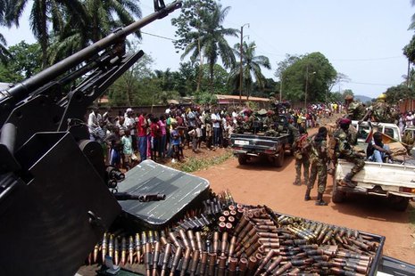 Armed fighters from the Seleka rebel alliance patrol the streets in pickup trucks to stop looting in Bangui, March 26, 2013. REUTERS/Alain A Armed fighters from the Seleka rebel alliance patrol the streets in pickup trucks to stop looting in Bangui, March 26, 2013. REUTERS/Alain A
