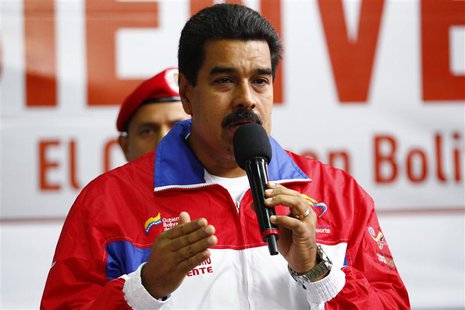 Venezuela's President Nicolas Maduro speaks during the inauguration of a funicular at Petare slum in Caracas August 14, 2013. REUTERS/Carlos Venezuela's President Nicolas Maduro speaks during the inauguration of a funicular at Petare slum in Caracas August 14, 2013. REUTERS/Carlos