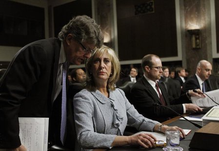 Ina Drew, (2nd L), former Chief Investment Officer of JP Morgan Chase Bank, confers with an aide before testifying before the Senate Homelan Ina Drew, (2nd L), former Chief Investment Officer of JP Morgan Chase Bank, confers with an aide before testifying before the Senate Homelan